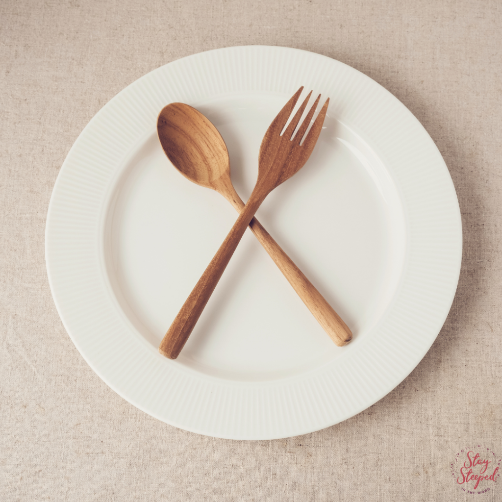 empty plate with spoon, fork and plate